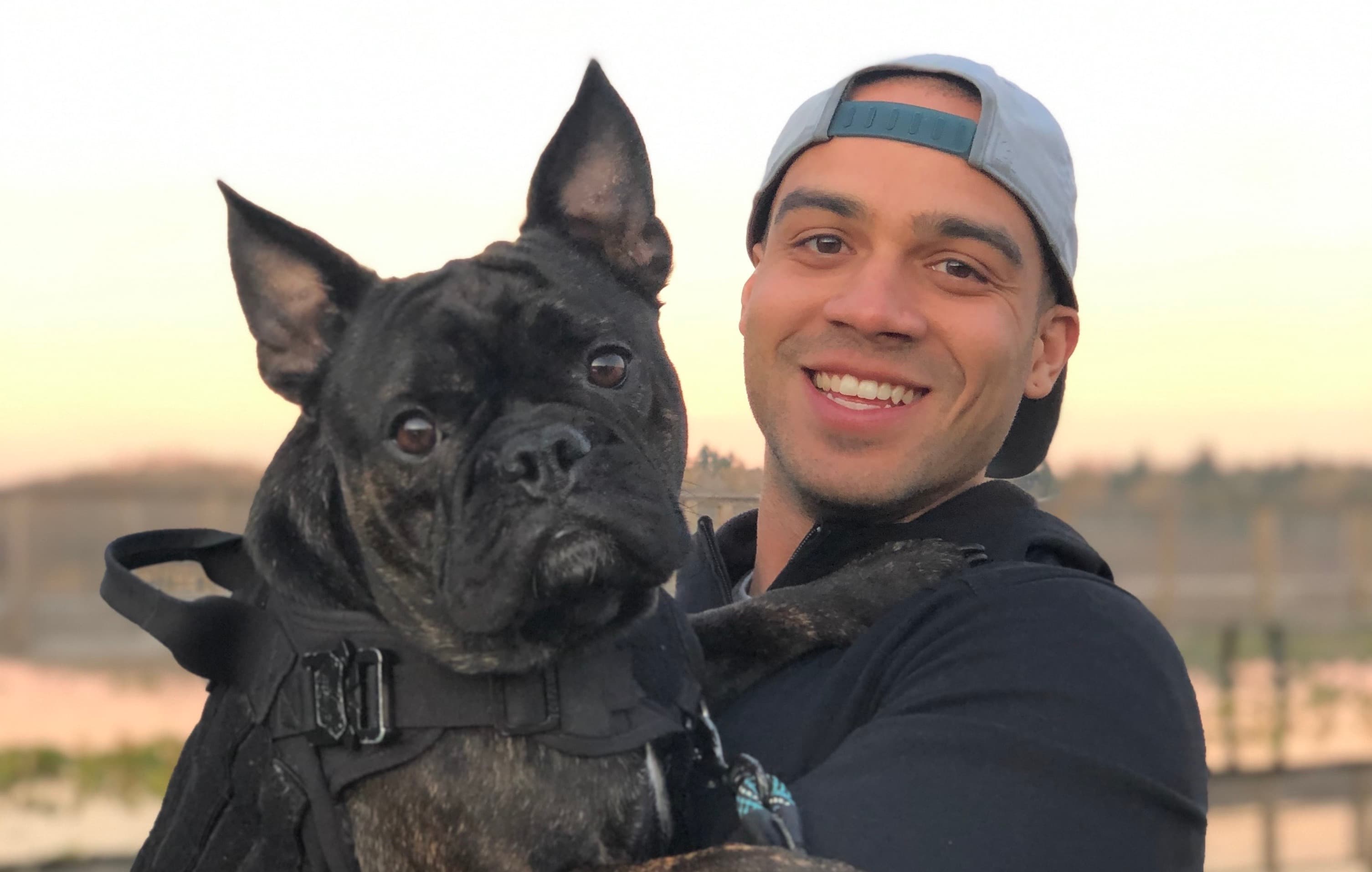 Devin Cunningham with his dog Stitch